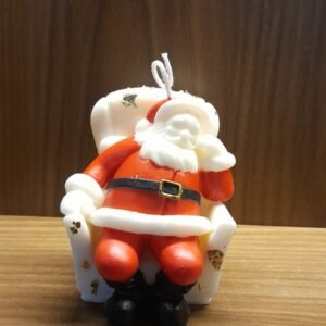Vela Papá Noel en su sillón